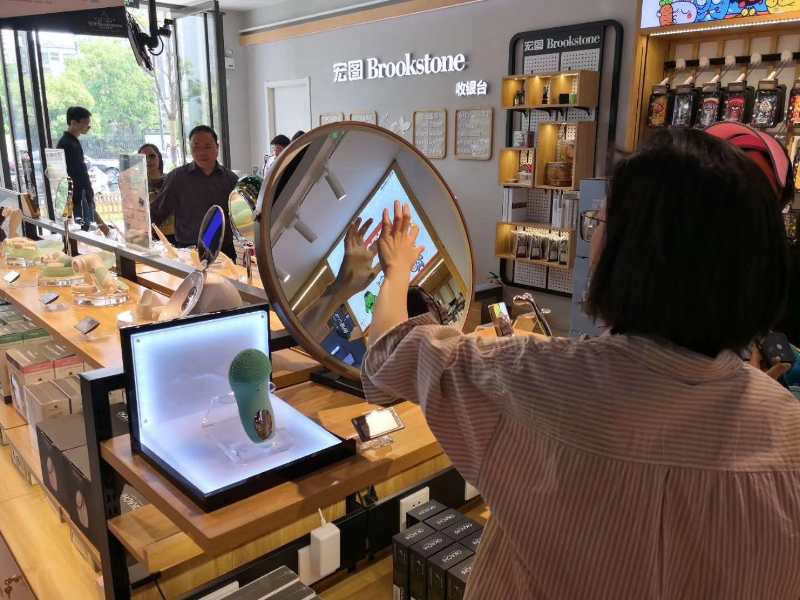 MIRROH LOONA smart beauty mirror at Brookstone retail for beauty demos